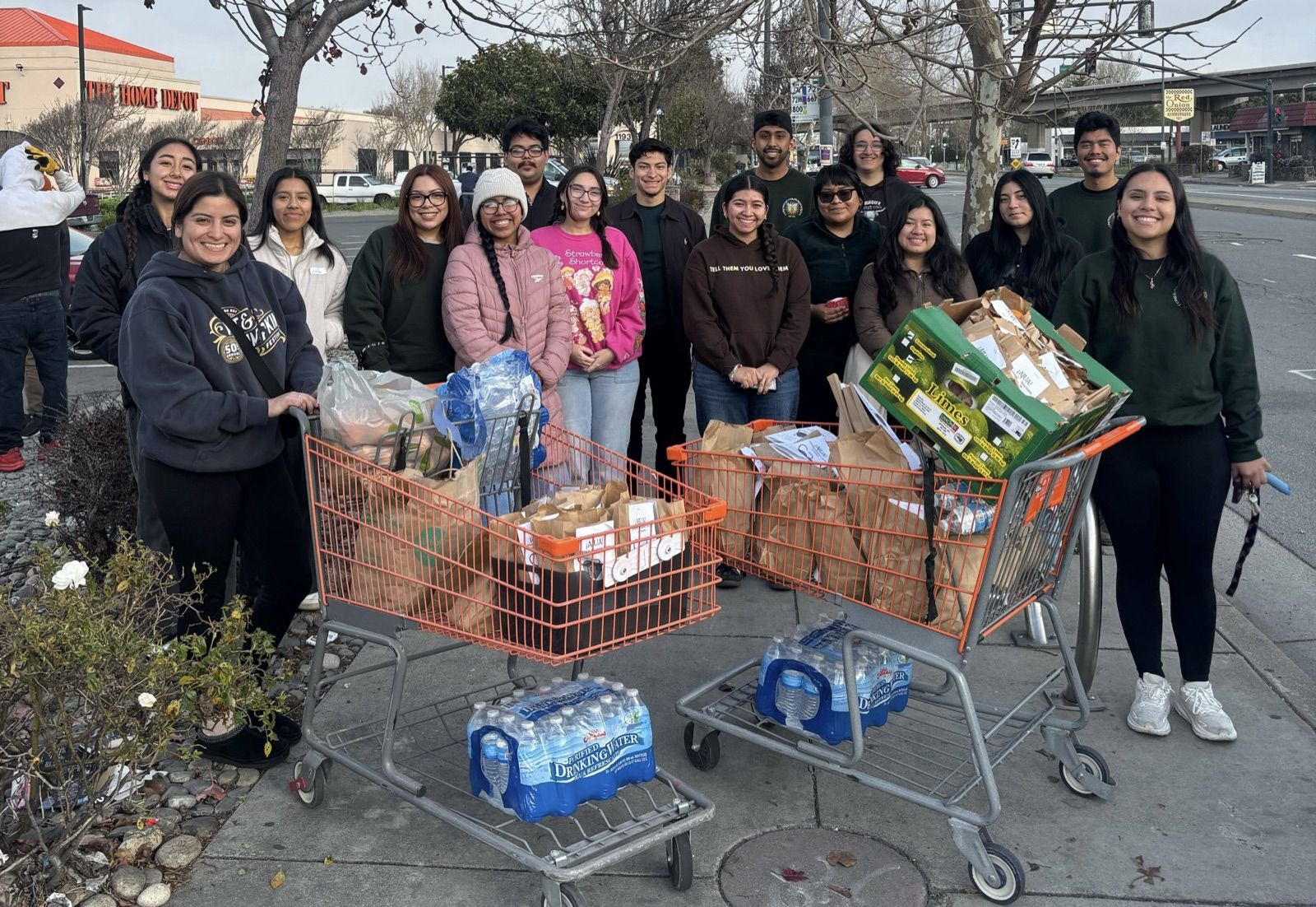 CHE volunteers with carts of prepared lunches and supplies during outreach in El Cerrito